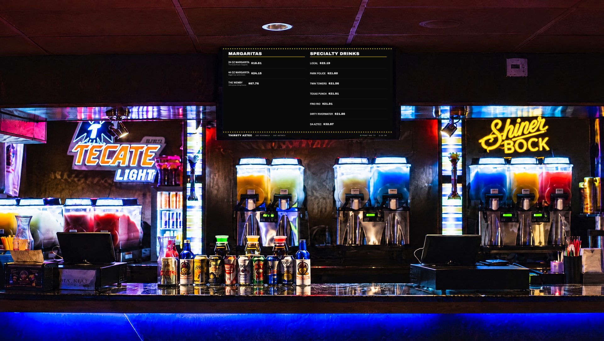 The Thirsty Aztec bar with the Marquee menu board on the TV above the frozen drink machines